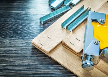 Composition of stapler metal staples wooden planks.